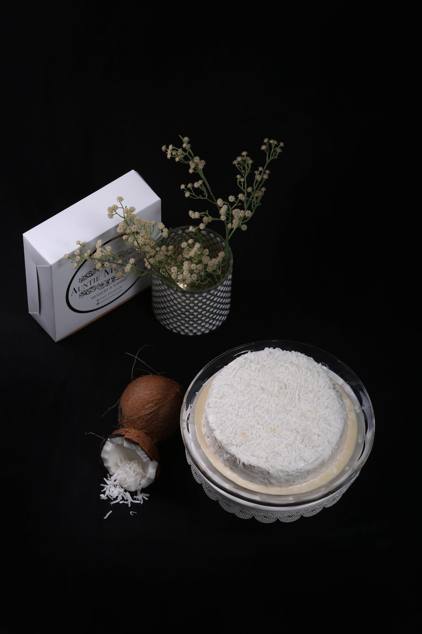 Coconut Infused Tres Leches Cake or Three Milk Cake with Coconut Cream Topping and Coconut Flakes