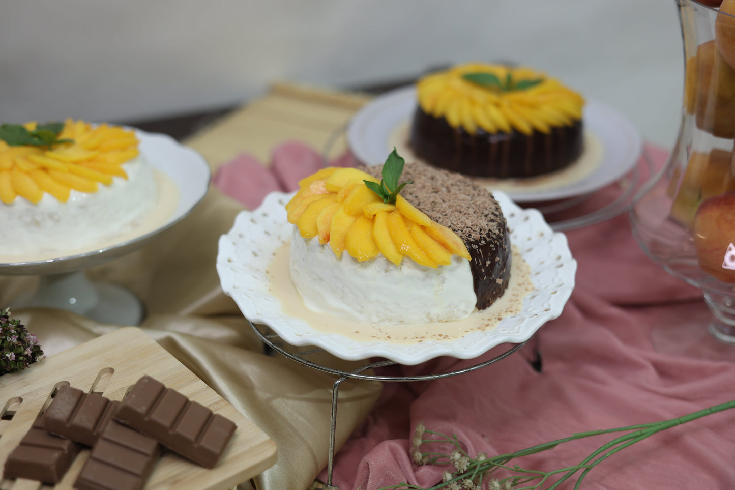 Chocolate and Peach Duo Tres Leches Cake: A delightful mix of rich chocolate and sweet peach, both soaked in a creamy Tres Leches blend and topped with fresh cream.