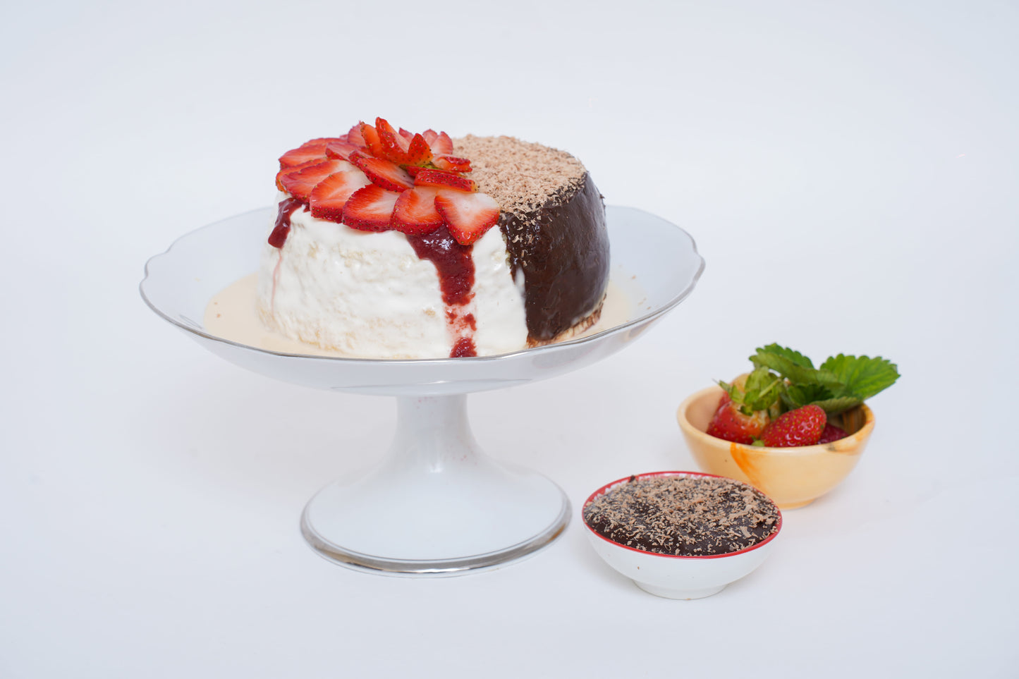 Duo Chocolate Strawberry Tres Leches Cake: Half rich chocolate and half creamy strawberry, both soaked in a luscious Tres Leches blend, topped with fresh cream and fresh strawberries.