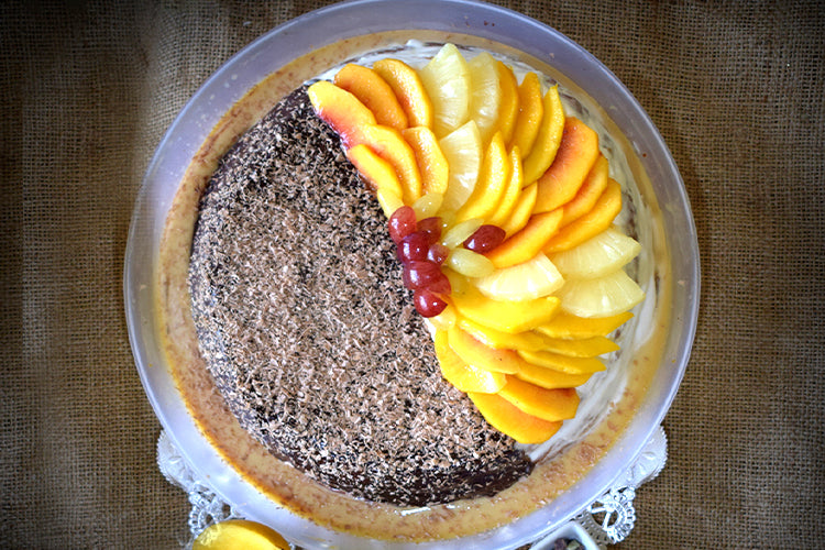 Duo Chocolate and Mixfruit Tres Leches Cake: Half rich chocolate and half fresh mixed fruit, soaked in a creamy Tres Leches blend, topped with smooth fresh cream.