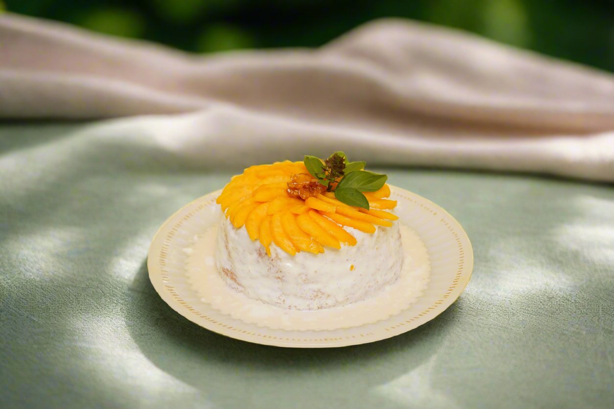 Mango Tres Leches Cake: Soft sponge soaked in a creamy Tres Leches blend, topped with fresh mango slices and smooth cream.