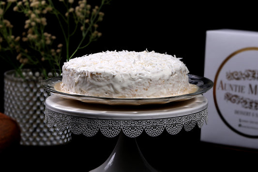 Coconut Infused Tres Leches Cake or Three Milk Cake with Coconut Cream Topping and Coconut Flakes