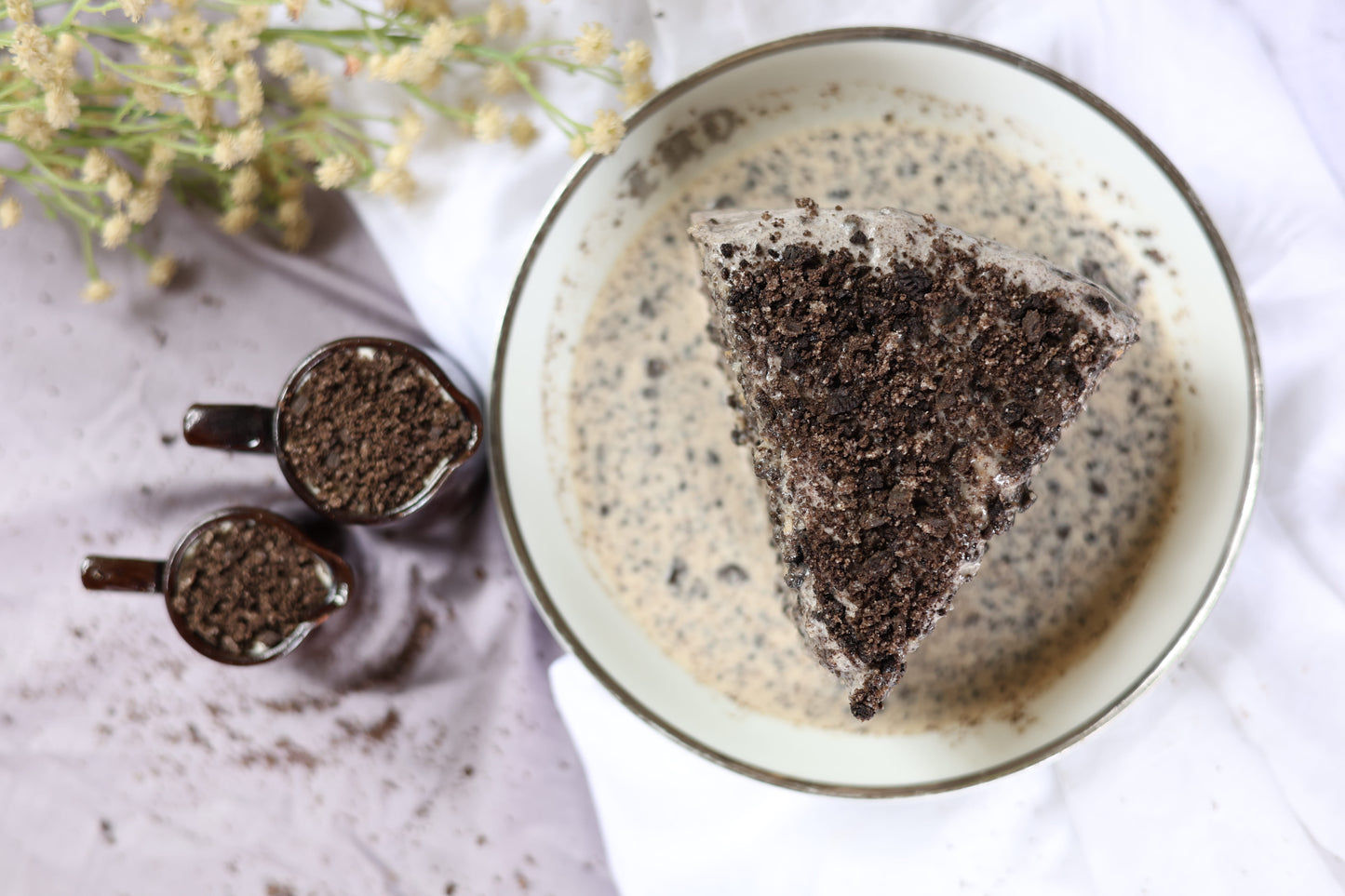 Cookies and Cream Tres Leches Cake: Oreo-infused sponge soaked in Tres Leches, topped with crunchy Oreo crumbs