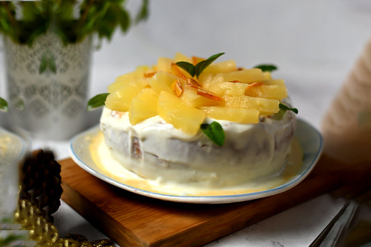 Pineapple Tres Leches Cake: Light sponge soaked in a creamy Tres Leches blend, topped with fresh pineapple slices and smooth cream.