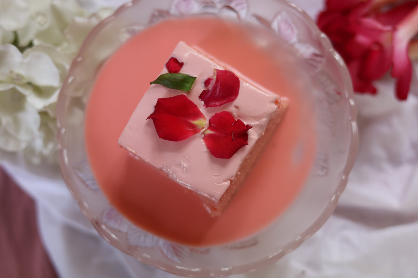 Rose Flavored Tres Leches Cake: Soft sponge soaked in a delicate rose-infused Tres Leches blend, topped with rose-infused cream and a hint of floral sweetness.