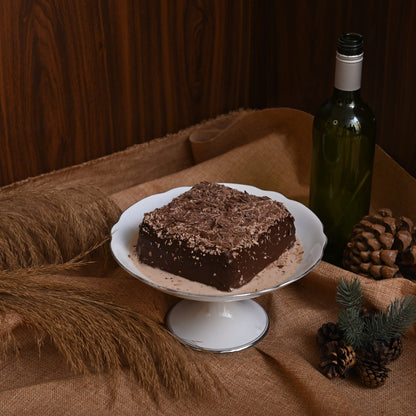 Triple Chocolate Tres Leches Cake: A rich chocolate sponge soaked in our signature Tres Leches blend, filled and covered with decadent chocolate, and topped with chocolate chunks for the ultimate chocolate indulgence.