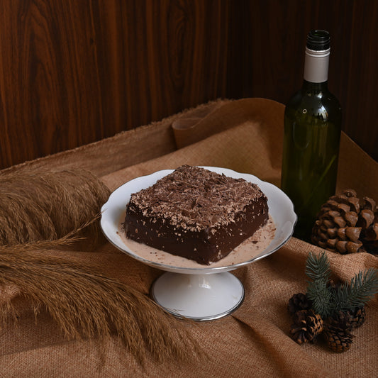 Triple Chocolate Tres Leches Cake: A rich chocolate sponge soaked in our signature Tres Leches blend, filled and covered with decadent chocolate, and topped with chocolate chunks for the ultimate chocolate indulgence.