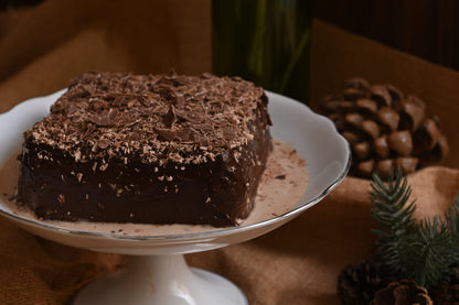 Triple Chocolate Tres Leches Cake: A rich chocolate sponge soaked in our signature Tres Leches blend, filled and covered with decadent chocolate, and topped with chocolate chunks for the ultimate chocolate indulgence.